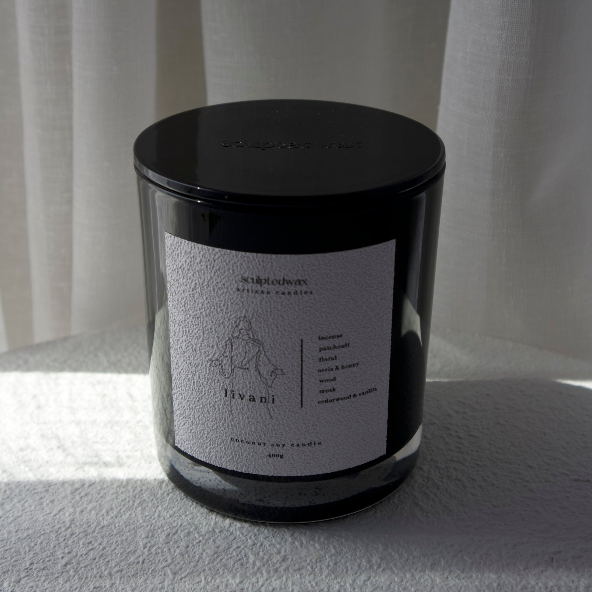 Livani limited edition incense and patchouli scented candle styled in modern interior for grounding rituals