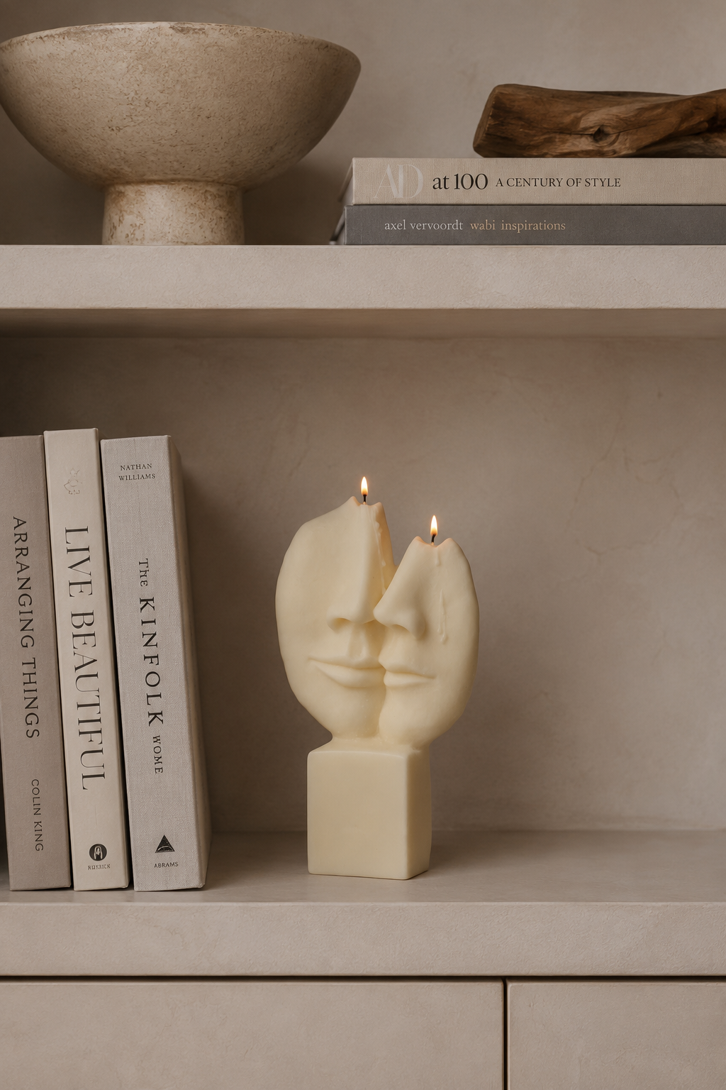 Lovers decorative sculptural candle styled on bookshelf 
