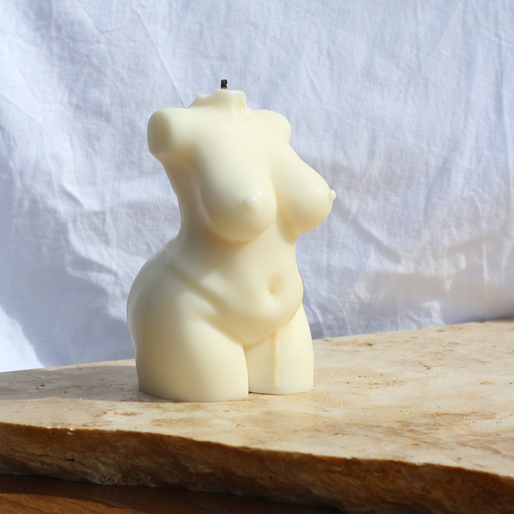 Peachy female body sculptural candle styled in calm home decor space, female body candle Australia