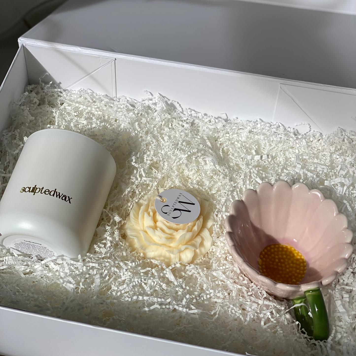 Candle gift set with soy candle, peony sculptural candle and pink sunflower mug arranged in a white gift box